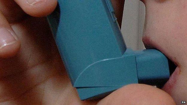 Child using blue inhaler
