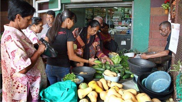 People shop on 13 November 2010 in Phoenix township in Durban, South Africa