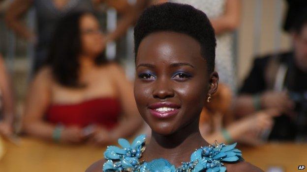 Actress Lupita Nyong'o arrives at the 20th annual Screen Actors Guild Awards in Los Angeles, California, on 18 January 2014