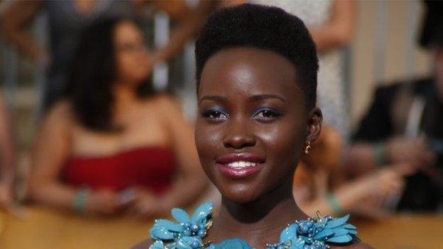 Actress Lupita Nyong'o arrives at the 20th annual Screen Actors Guild Awards in Los Angeles, California, on 18 January 2014