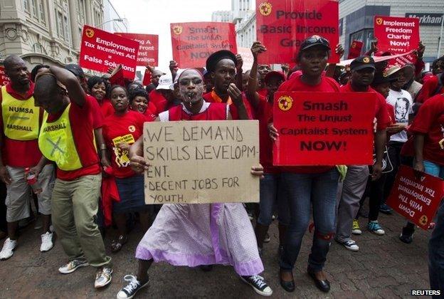 Members of the National Union of Metal Workers of South Africa (NUMSA) protest as they march through Durban (19 March 2014)