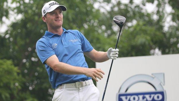 Michael Hoey watches a drive during the first round at the China Open