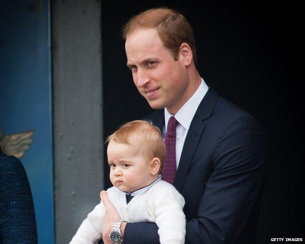 Prince George in the arms of his father, Prince William