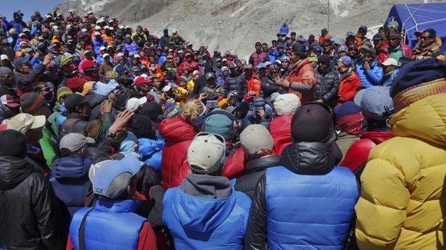 This April 24, 2014 photo released by Adrian Ballinger, founder and head guide of Alpenglow Expeditions, shows a meeting between Nepalese government delegation and Sherpa mountain guides near Everest base camp