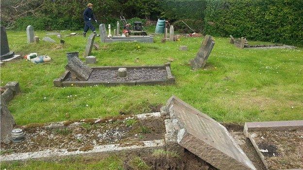 Gravestone damage following winter flooding in Moorland, Somerset