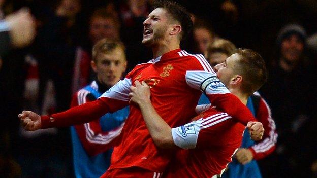 Adam Lallana (left) celebrates a goal with Luke Shaw