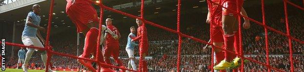 Raheem Sterling and Glen Johnson (L) of Liverpool make a goal-line clearance during the Barclays Premier League match between Liverpool and Manchester City at Anfield.