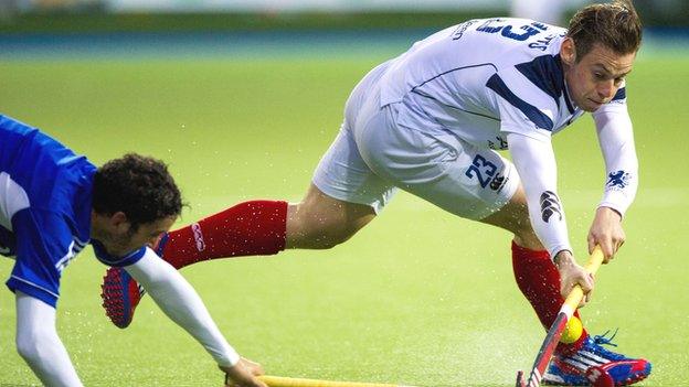 Scotland's Gavin Byers (right) is tackled by Rey Lucas of Argentina