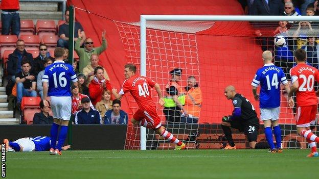 Everton's Antolin Alcaraz (lying down) gifts Southampton the lead at St Mary's with a first-minute own goal