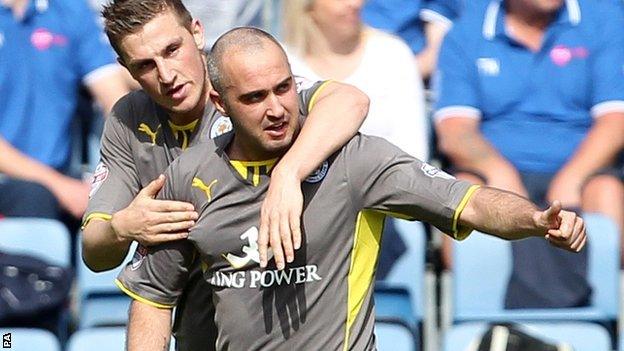 Gary Taylor-Fletcher (right) celebrates scoring for Leicester at Huddersfield