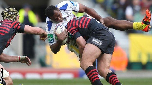 Schalk Brits tackled Sitiveni Sivivatu as Kelly Brown (left) looks on