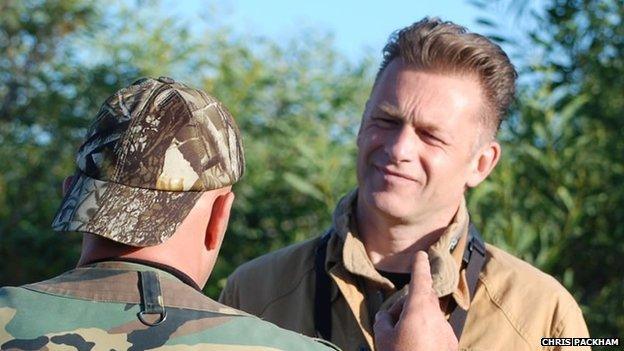 Chris Packham with a hunter