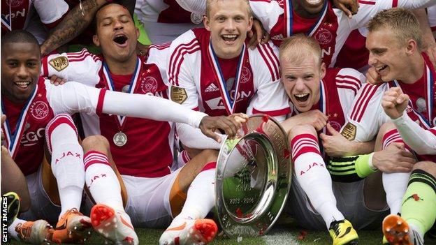 Ajax players celebrate the title