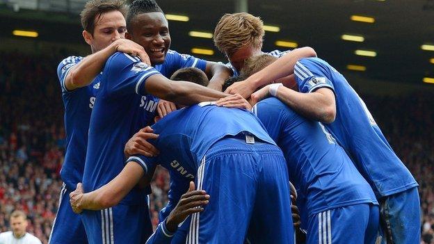 Chelsea celebrate a goal at Anfield