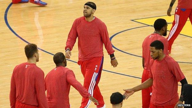 Los Angeles Clippers players warm up with shirts on inside out