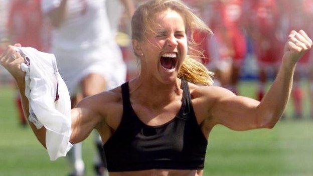 Brandi Chastain with her bra exposed