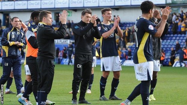 Torquay United's players and staff after their relegation was confirmed at Mansfield