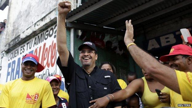 Jose Domingo Arias, presidential candidate of the ruling Democratic Change (CD) party, greets supporters during a walking campaign in a low income neighborhood in Panama City April 21, 2014