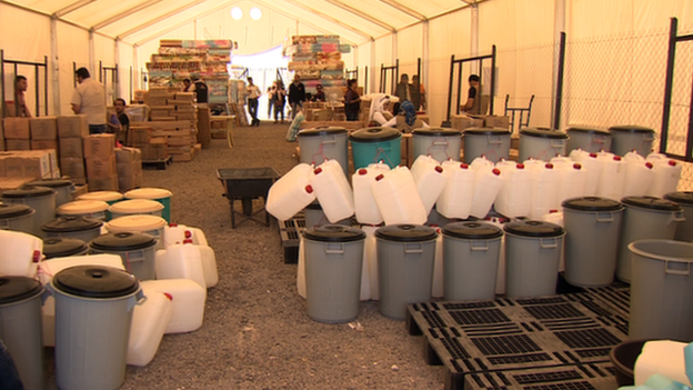 Containers inside shelter in Camp Azraq