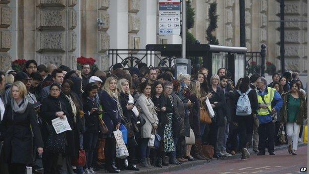 People wait for buses at Victoria Station