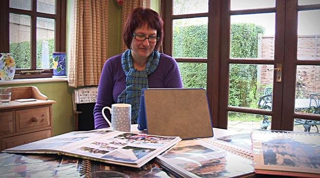 Claire Cummings is looking at a tablet
