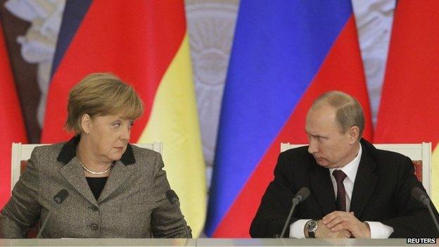 File photo of Russian President Vladimir Putin (R) and German Chancellor Angela Merkel answering journalists" questions during a joint news conference in Moscow's Kremlin 16 November 2012