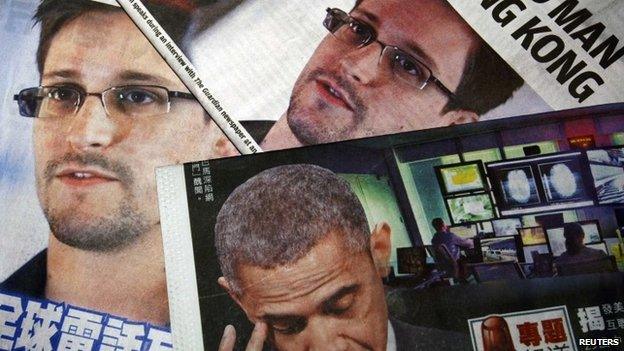 Photos of Edward Snowden, a contractor at the US National Security Agency (NSA), and US President Barack Obama are printed on the front pages of local English and Chinese newspapers in Hong Kong in this file illustration photo taken on 11 June 2013