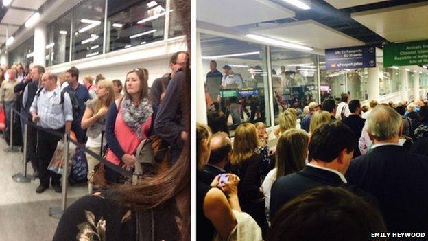 Passengers queue at Gatwick Airport