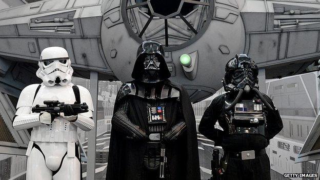 Fans dressed as Darth Vader and imperial soldiers gather at a convention in Germany on 28 July, 2013.