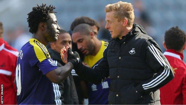 Swansea coach Garry Monk and striker Wilfried Bony shake hands after a match