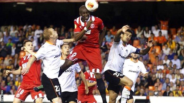 Stephane Mbia heads Sevilla's decisive goal in the semi-final with Valencia