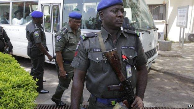 Security men stand guard outside Asokoro hospital in Abuja, Nigeria - April 16 2014