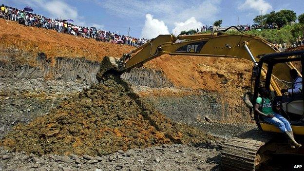 Rescuers work on the removal of sludge in Santander de Quilichao, Colombia - 1 May 2014