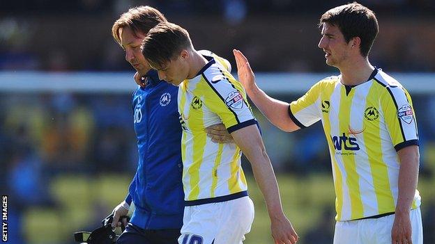 Billy Bodin limps off against Dagenham