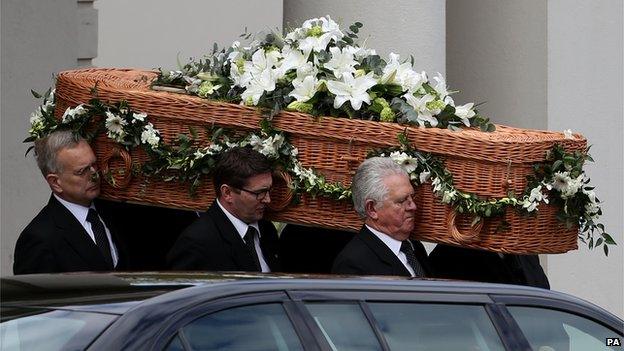 Sue Townsend's casket carried out of the theatre