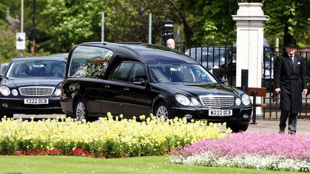 A hearse carrying the coffin of author Sue Townsend arrives at the De Montfort Hall, Leicester, for her funeral service