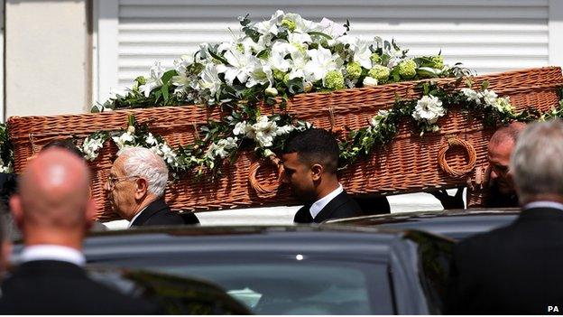 The coffin of author Sue Townsend leaves the De Montfort Hall following her funeral service in Leicester city centre