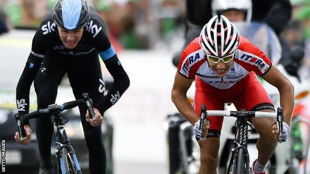 Britain's Chris Froome (left) beaten by Simon Spilak in a sprint finish in stage three of the Tour de Romandie