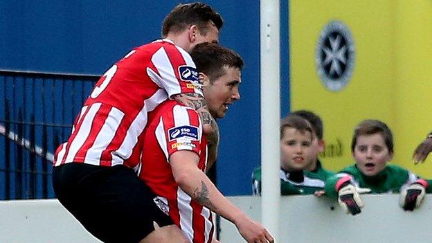 Jon Paul McGovern celebrates with Derry goalscorer Patrick McEleney