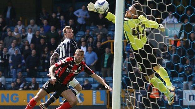 Martyn Woolford glances a header past Lee Camp to give Millwall the lead