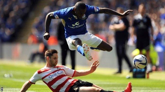 Doncaster Rovers's Dean Furman challenges Leicester City's Lloyd Dyer