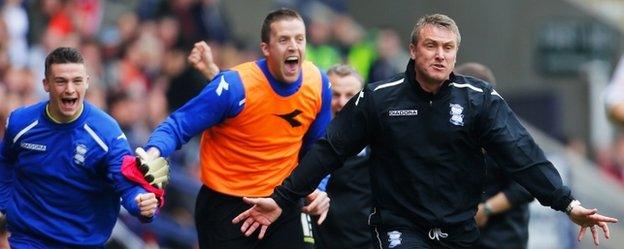 Birmingham City manager Lee Clark and his bench celebrate clinching Championship survival