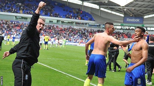 Birmingham manager Lee Clark celebrates at ensuring Championship survival for his side with a 2-2 draw at Bolton