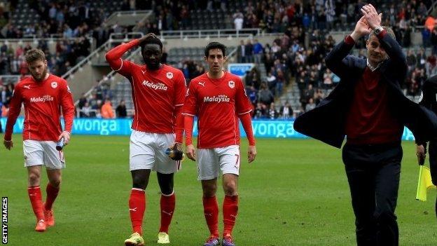 Cardiff manager Ole Gunnar Solskjaer applauds his relegated side's fans after the final whistle