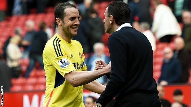 Gus Poyet congratulates John O'Shea