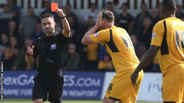 Ryan Jackson (far right) is shown the red card dyring Newport's 2-1 win over Rochdale