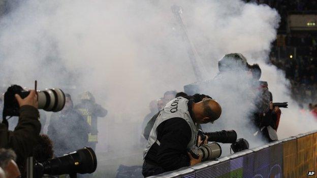 Smoke from flares thrown by supporters during the Italian cup final, 3 May 2014