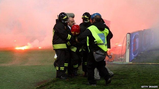 Injured firefighter at the Olympic Stadium in Rome, 3 May 2014