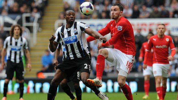 A Cardiff player and a Newcastle United player battle it out during a match at the weekend.