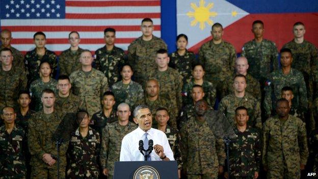 US President Barack Obama delivers remarks to US and Philippine troops at Fort Bonifacio in Manila on April 29, 2014. Obama delivered a fresh warning on April 29 to China against using force to resolve territorial disputes, as he pledged 'ironclad' military support for the Philippines.